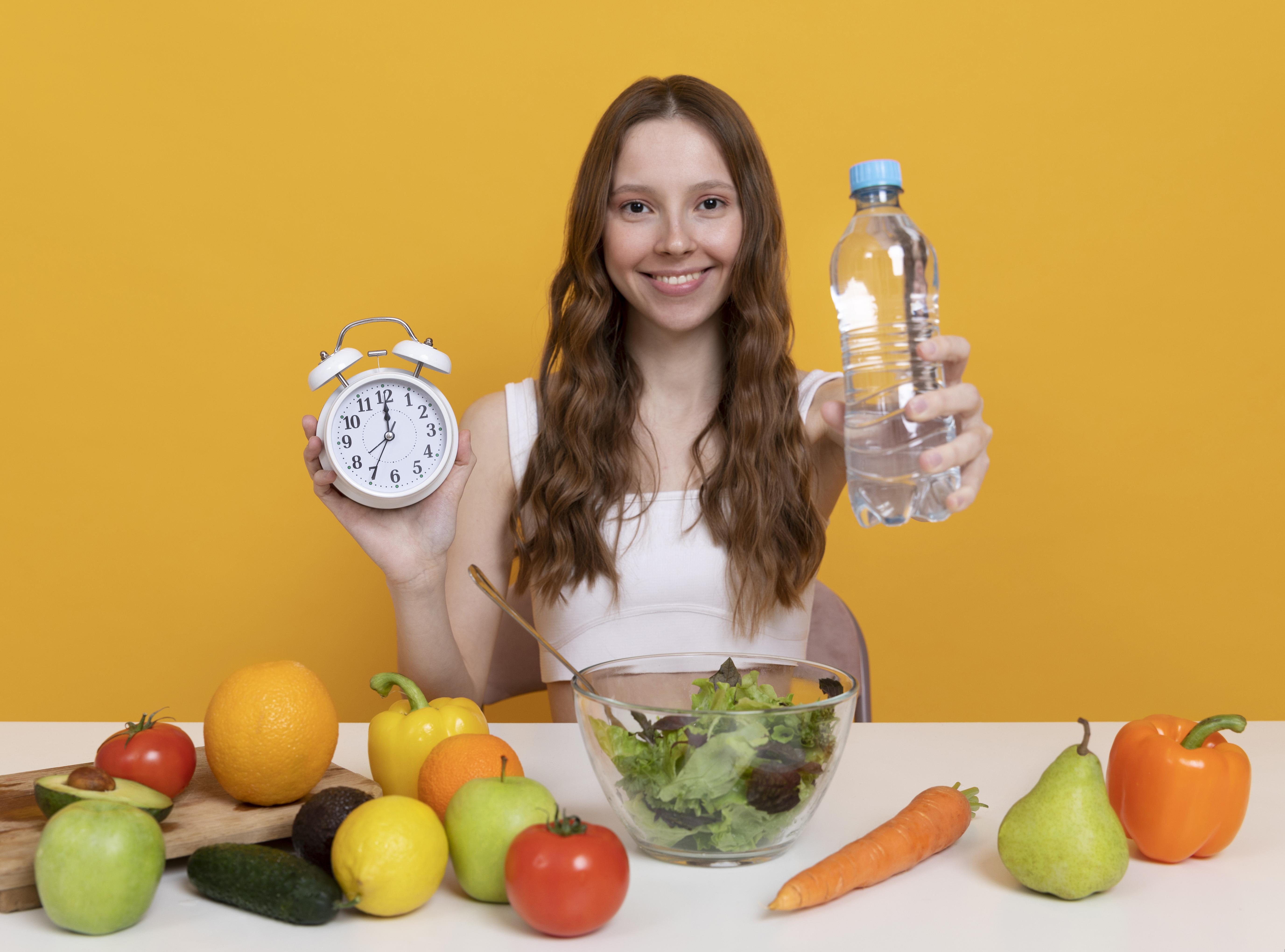 Lady holding water bottle during fasting period